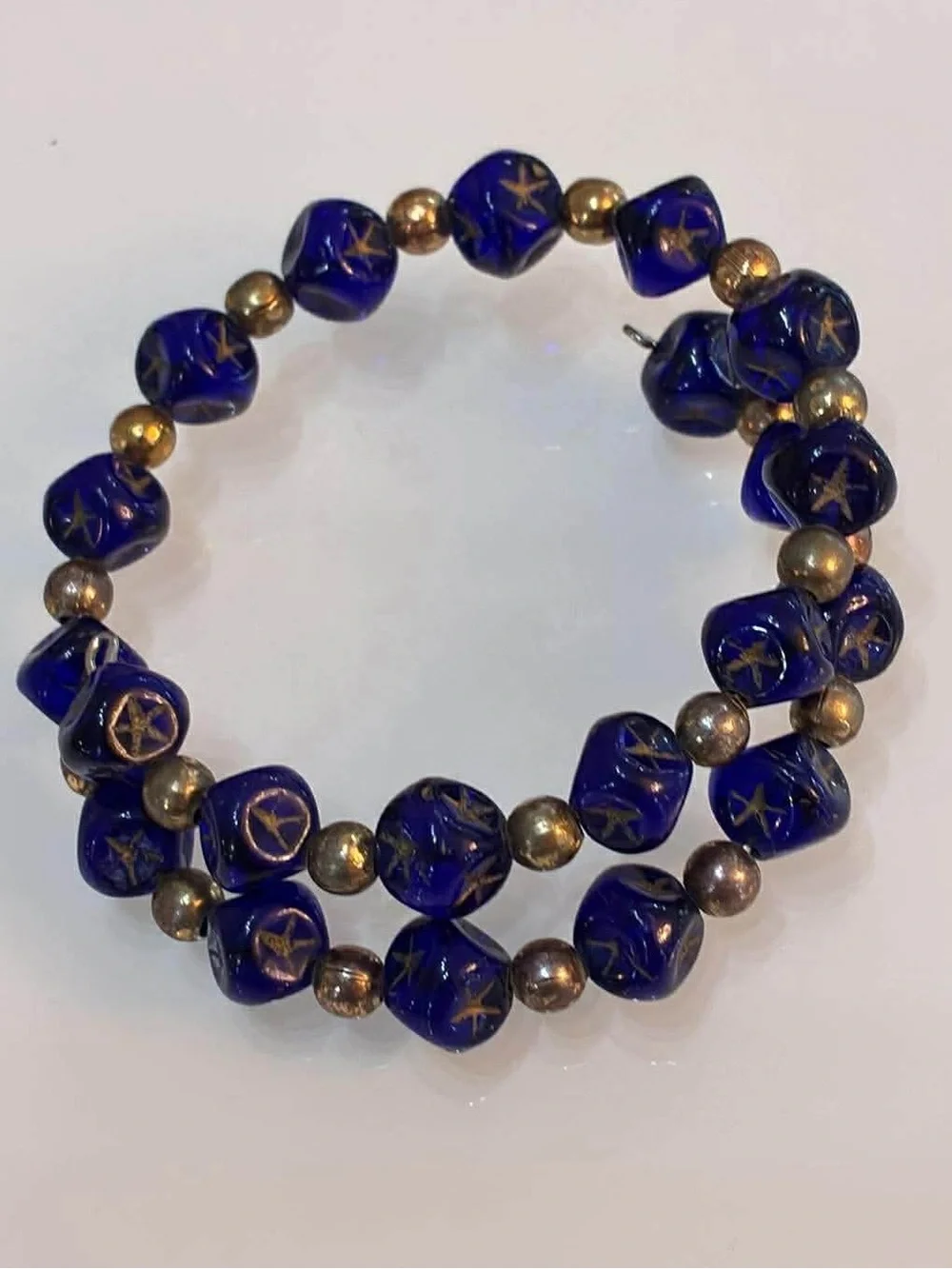 Handcrafted Blue Glass Bead Bracelet with Gold Accents